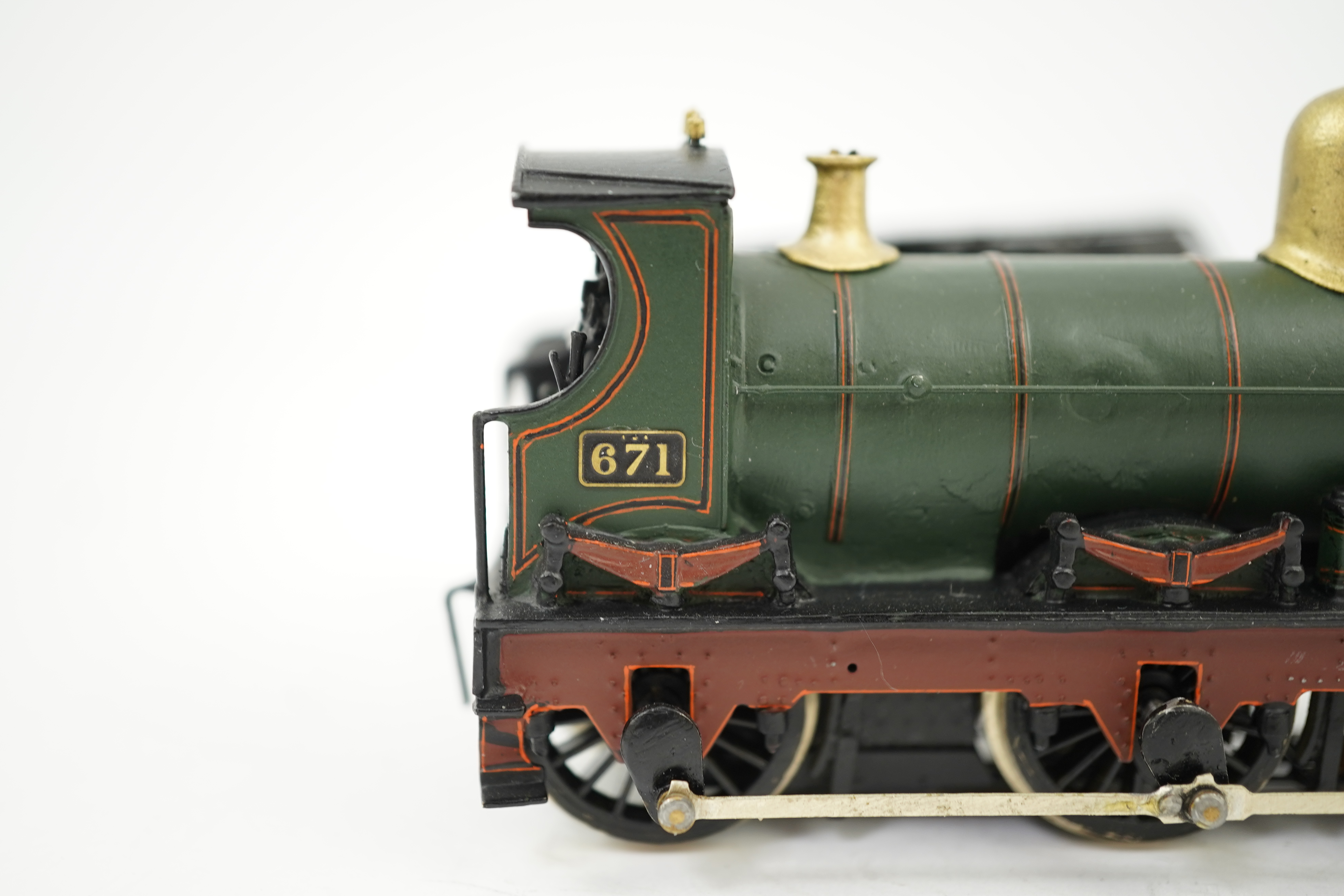 Two 00 gauge brass and white metal kit built GWR tender locomotives; an Armstrong 0-6-0, 671, together with an Earl class 4-4-0, Earl of Berkeley 3217, constructed, painted and lined to a high standard, both motored for
